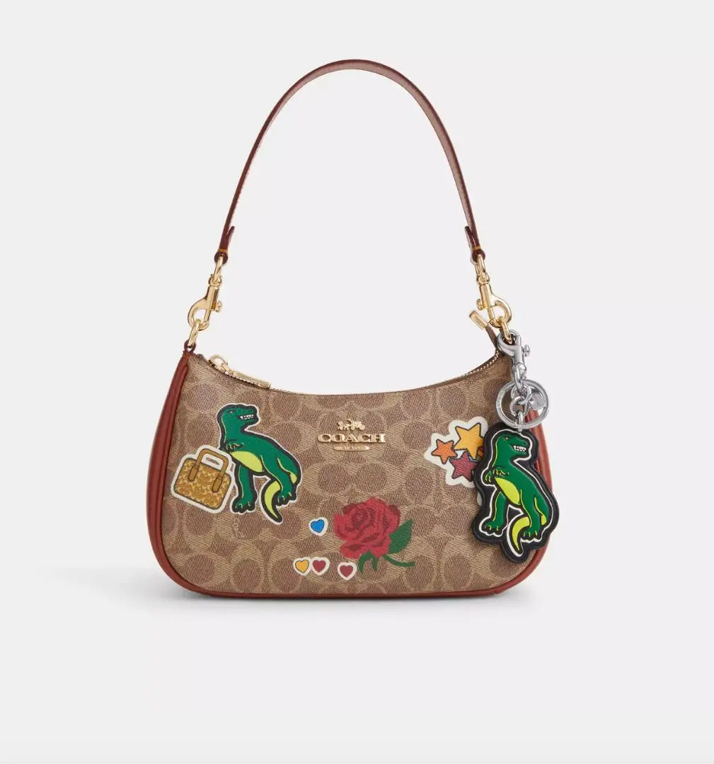 Nuevo dije para bolso con pegatina de dinosaurio de Coach