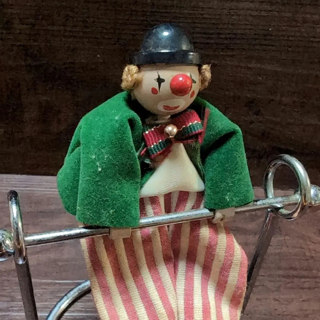 Clown pendulum figurine