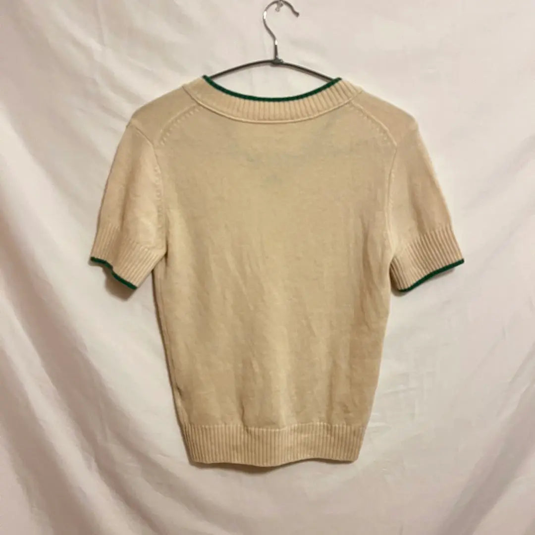 Jersey vintage LACOSTE de punto de manga corta con cuello en V y canalé británico