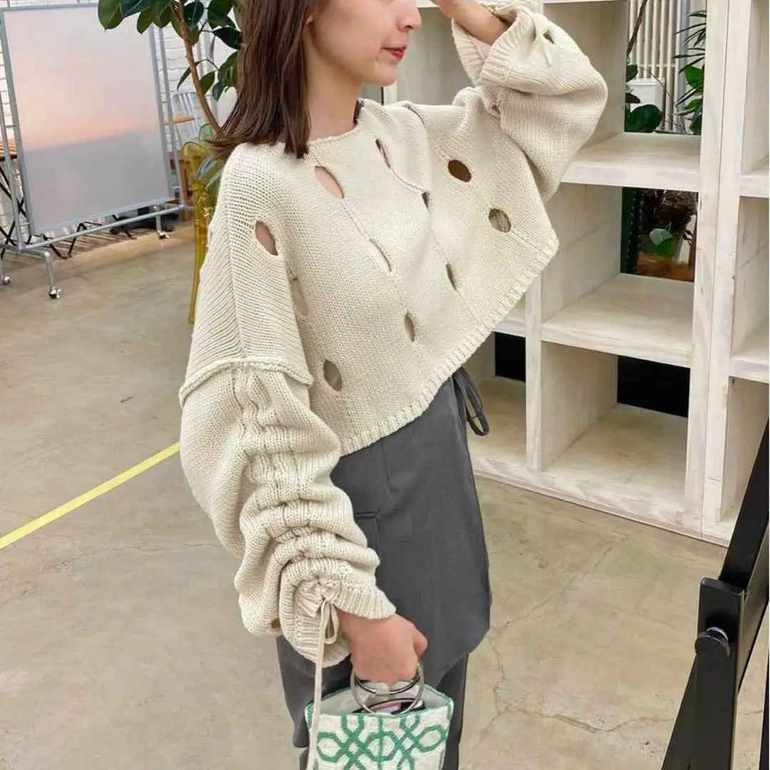 Perforated design cream color knit sweater