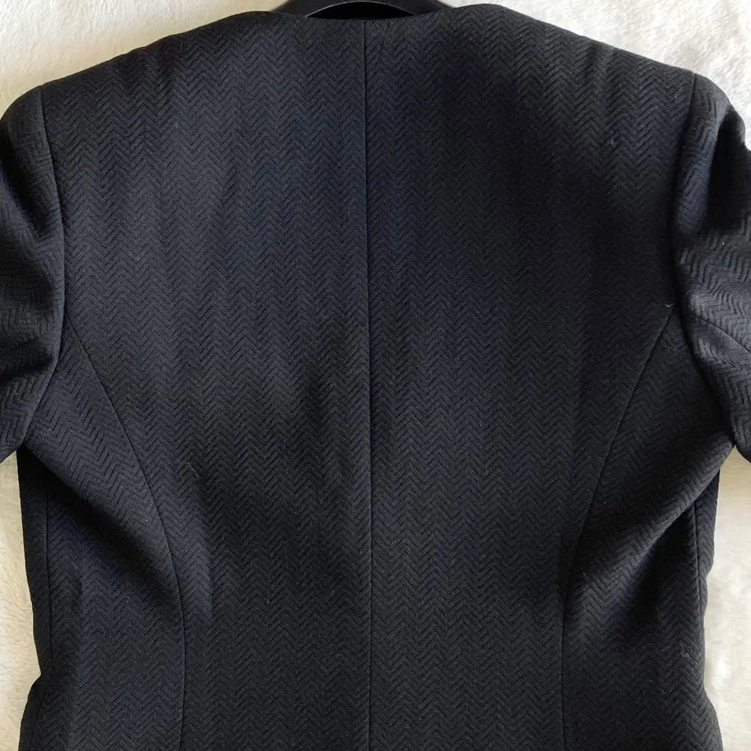 Conjunto de chaqueta y falda de lana de Christian Dior en color negro talla L