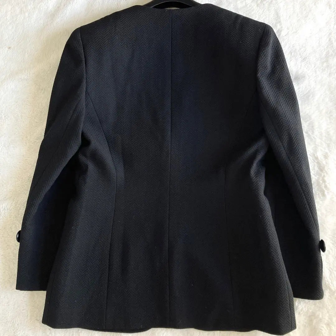 Conjunto de chaqueta y falda de lana de Christian Dior en color negro talla L