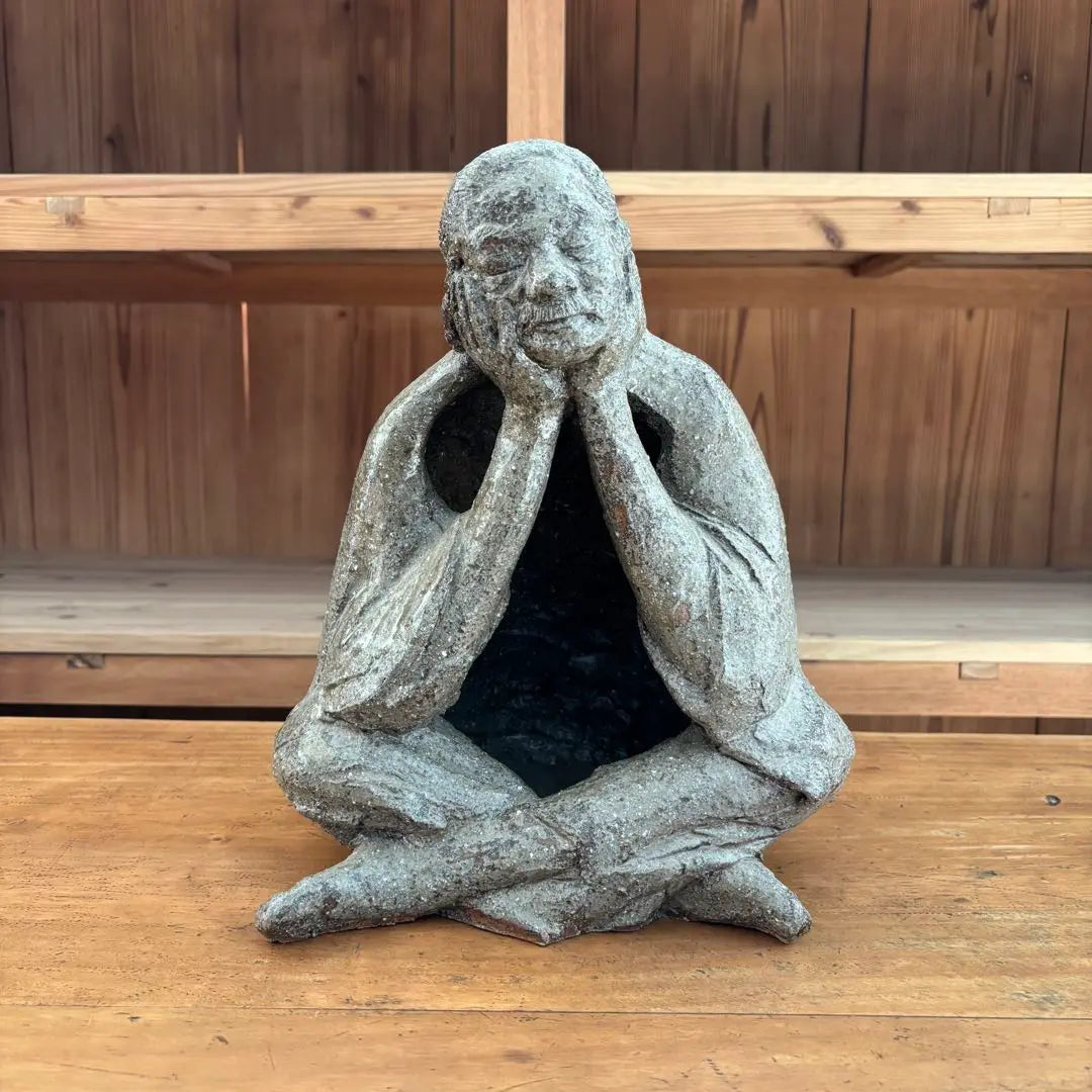 Ceramic sculpture: A vaguely thoughtful figure, ornament, object