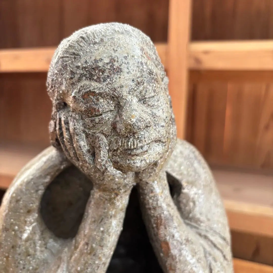 Ceramic sculpture: A vaguely thoughtful figure, ornament, object