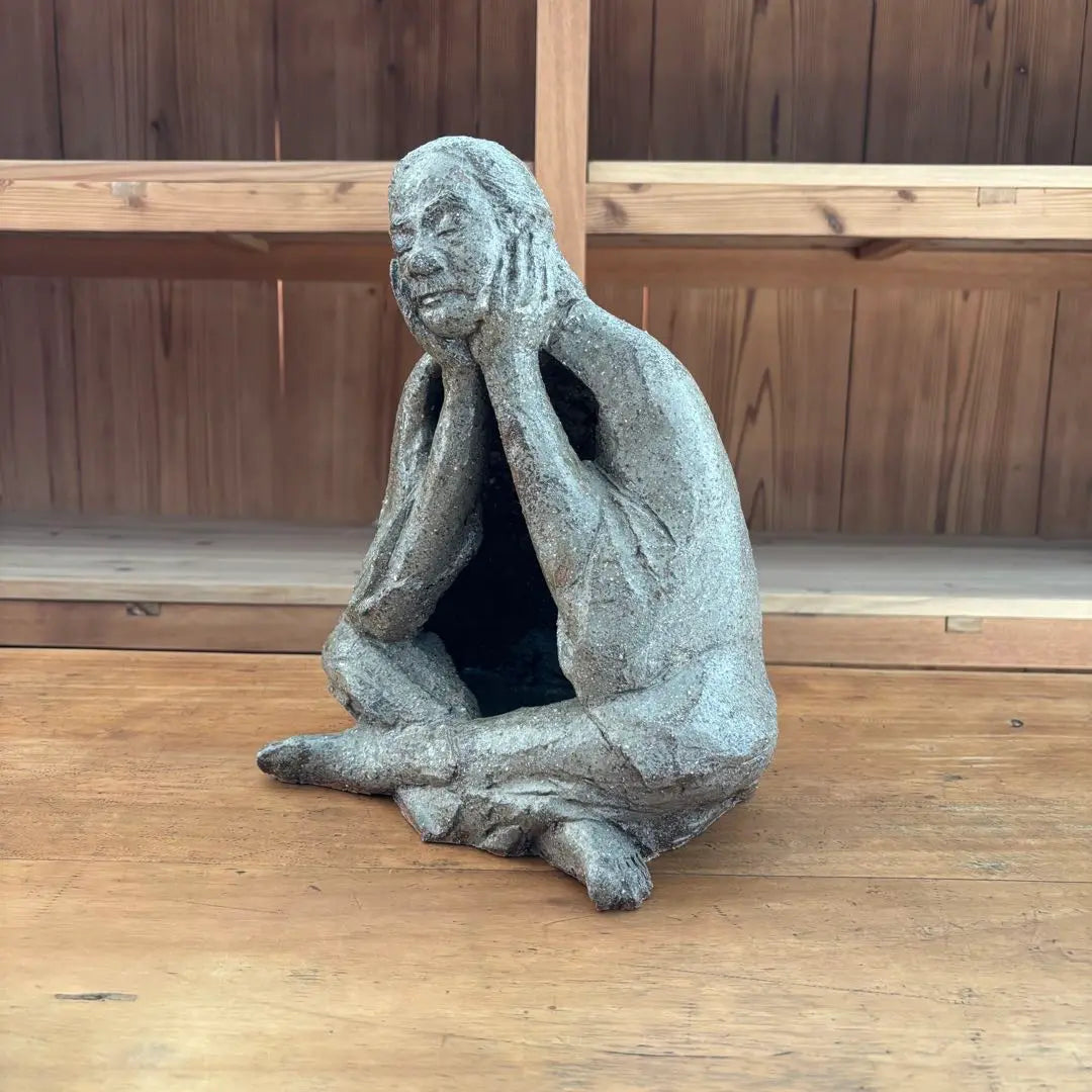 Ceramic sculpture: A vaguely thoughtful figure, ornament, object