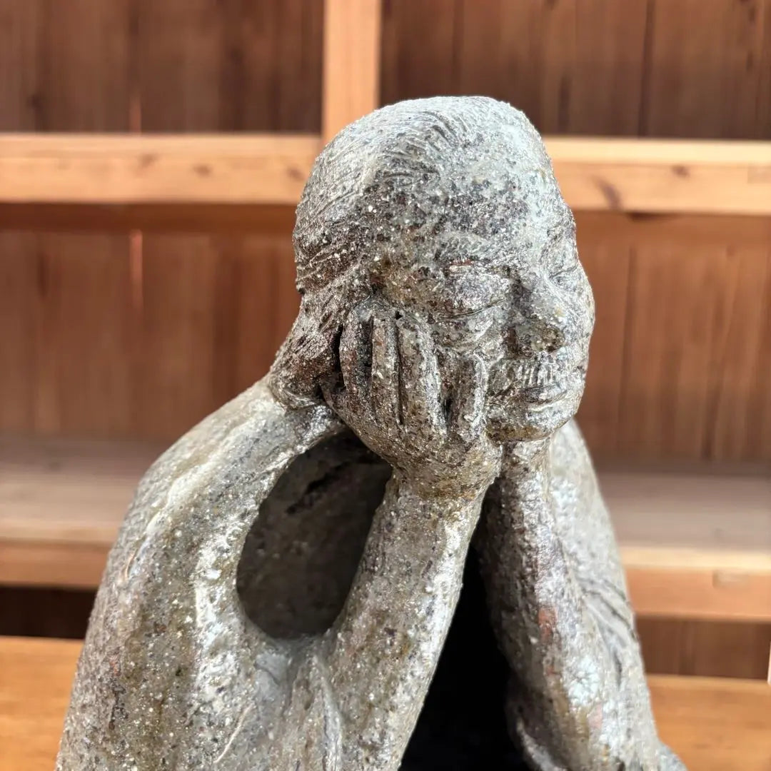 Ceramic sculpture: A vaguely thoughtful figure, ornament, object