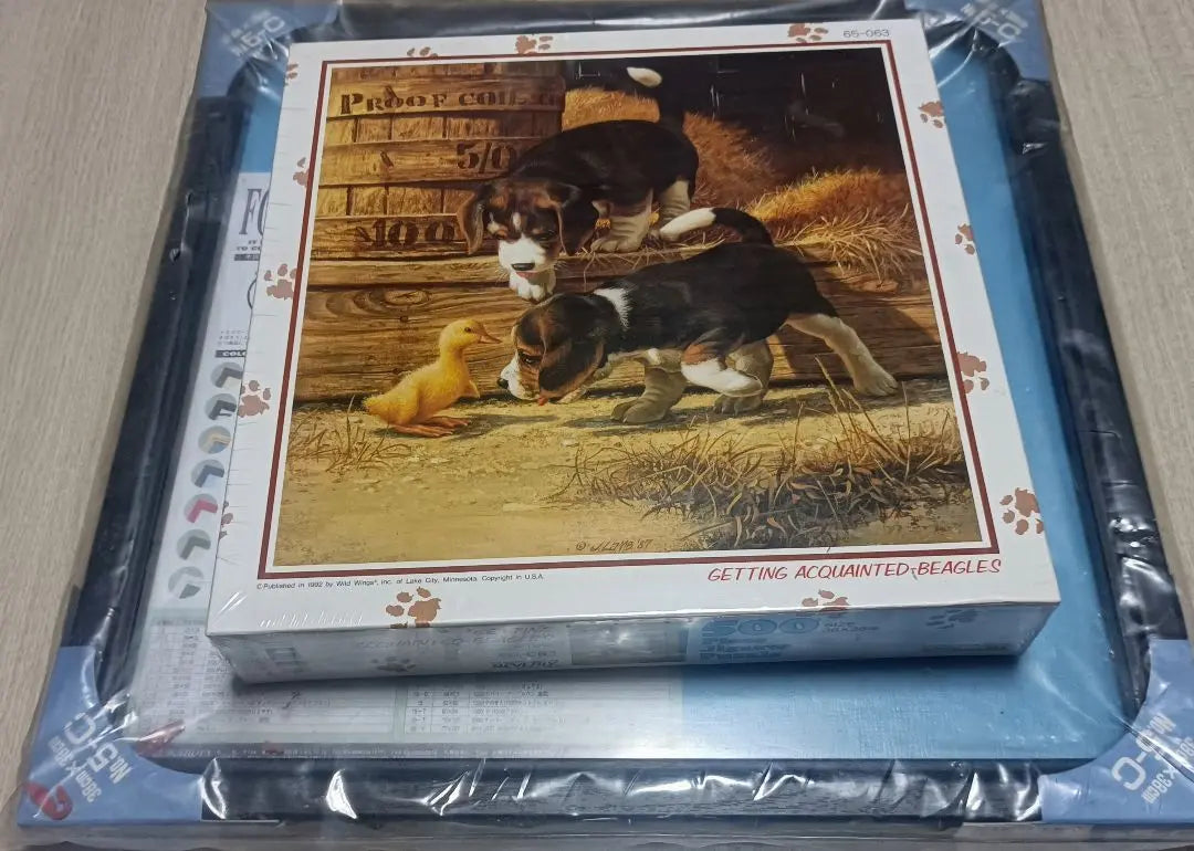 A 500-piece jigsaw puzzle with a beagle and duckling and a two-piece set