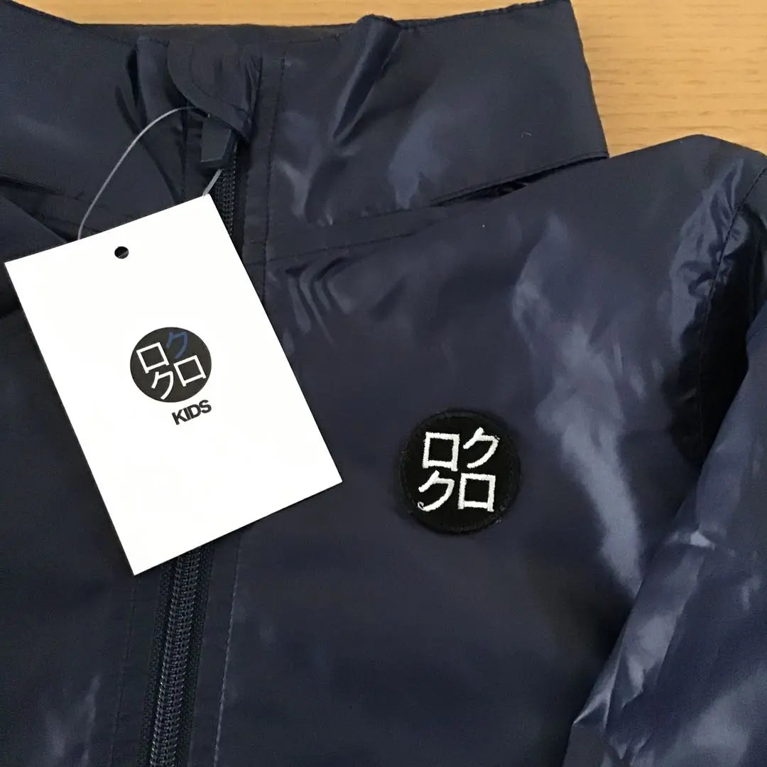 Rokuroku Tag Black 90 Navy 100 Windbreaker Folded and stored