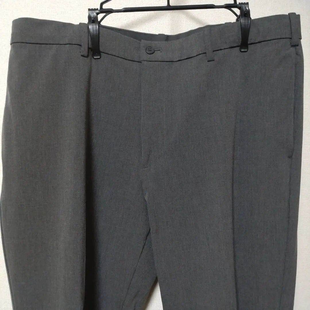 Pantalón gris UNIQLO XL con correa de cintura ajustable, material elástico, artículo hermoso