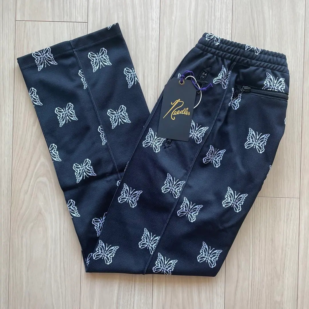 Brand new, unused needles track pants, black, papillon, all-over pattern