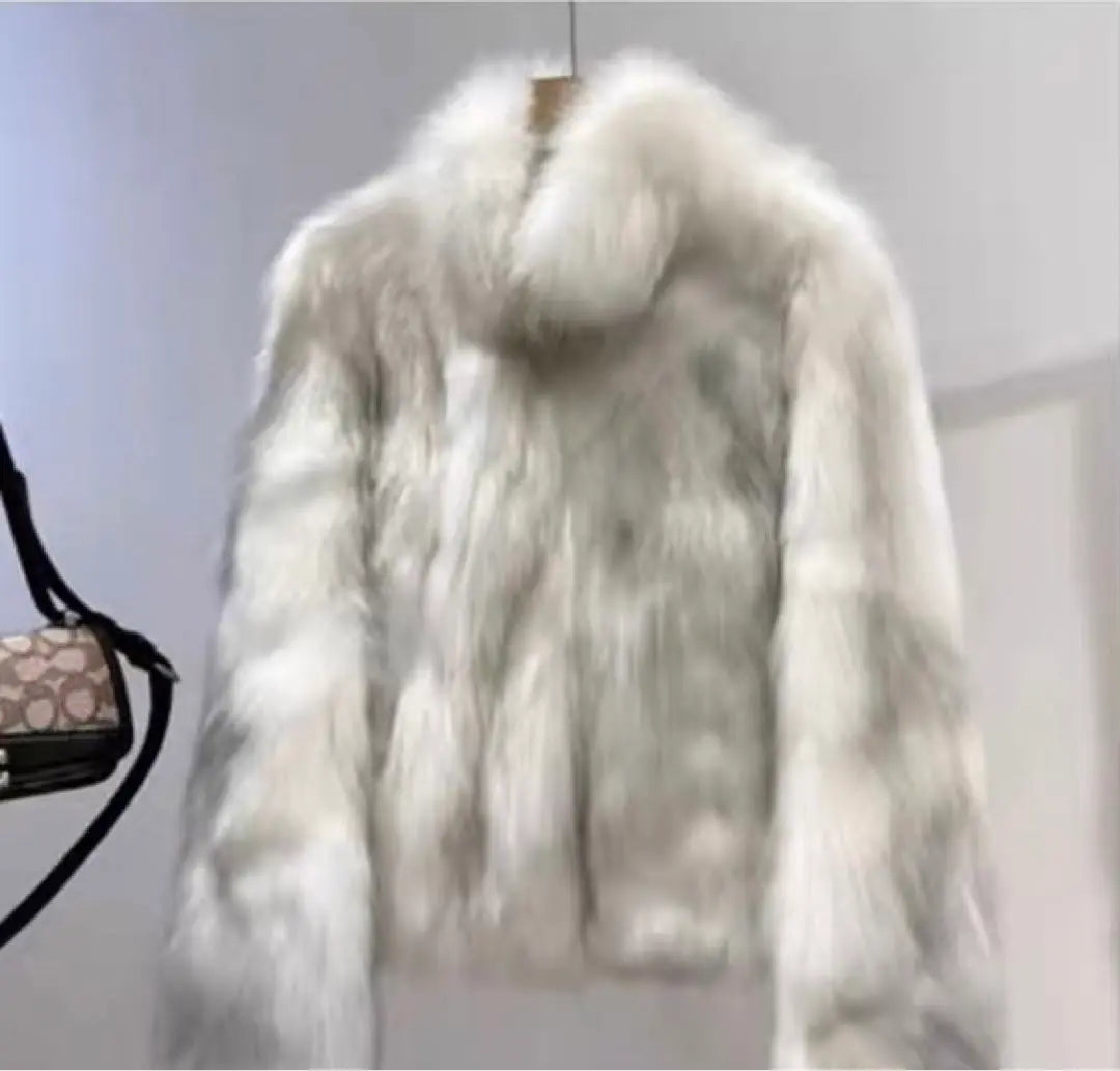 A fur coat that is fluffy and comfortable to wear and is perfect for cold seasons