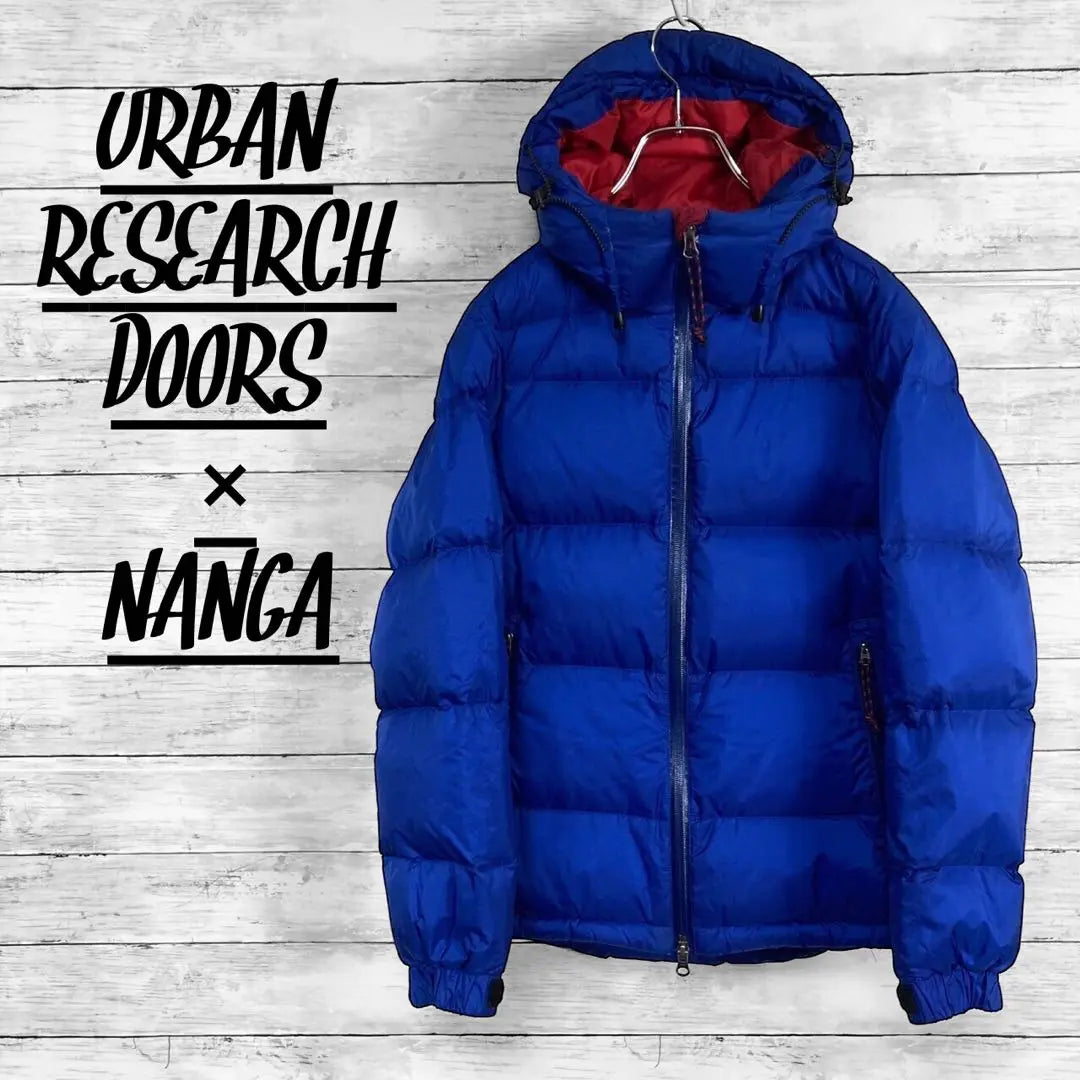 Chaqueta de plumas azul de la colaboración Drawers x Nanga de Urban Research, talla única