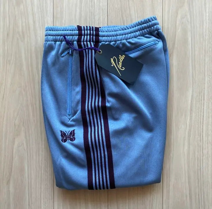 Brand new, unused needles track pants, sax blue, wine red