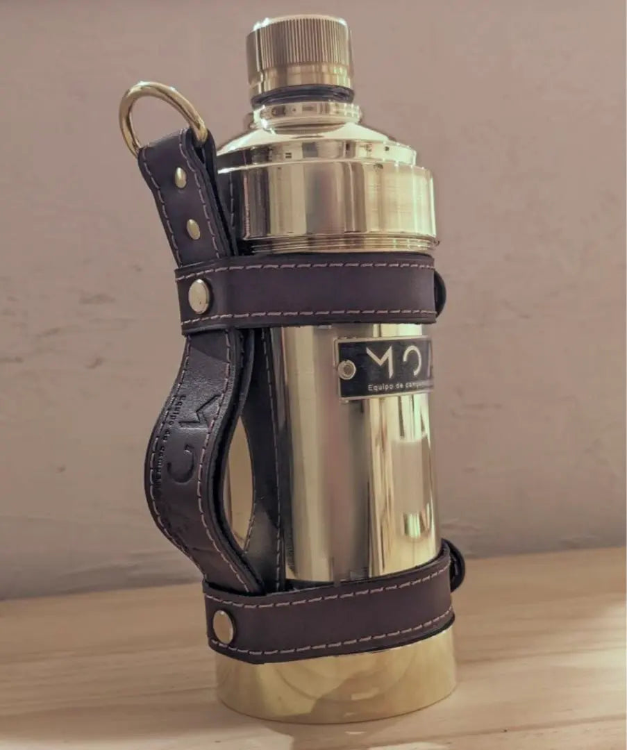 delica moai brass plastic bottle case with leather holder